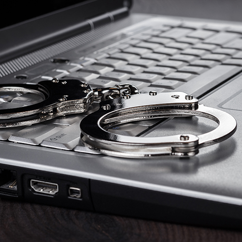 Private investigator conducting cyber crime investigation to trace online fraud and identity theft.