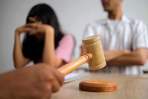 Private investigator conducting discreet surveillance to gather evidence in a divorce case.